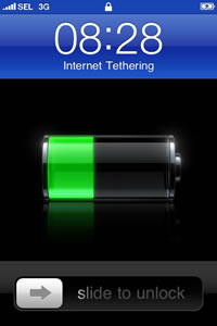 iPhone 3G home screen during Internet Tethering shows a thick blue bar on the top, digital clock, and battery position.