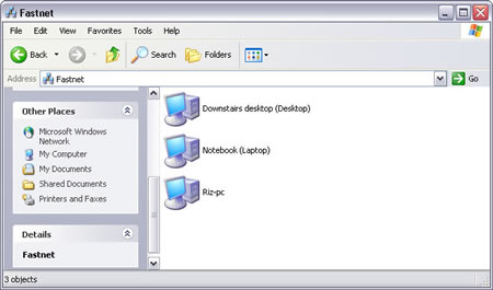 Windows XP > My Network Places > View workgroup computers : FASTNET : DESKTOP, RIZ-PC, and LAPTOP shown on Windows Explorer. Double-click a connected computer to open shared files/folders/printers stored in it.